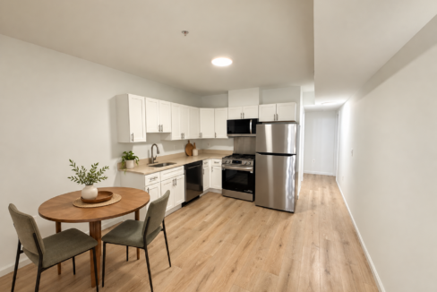 Virtually staged kitchen and dining area in unit #201, shown as representative photos for 1358 Queen St NE #202